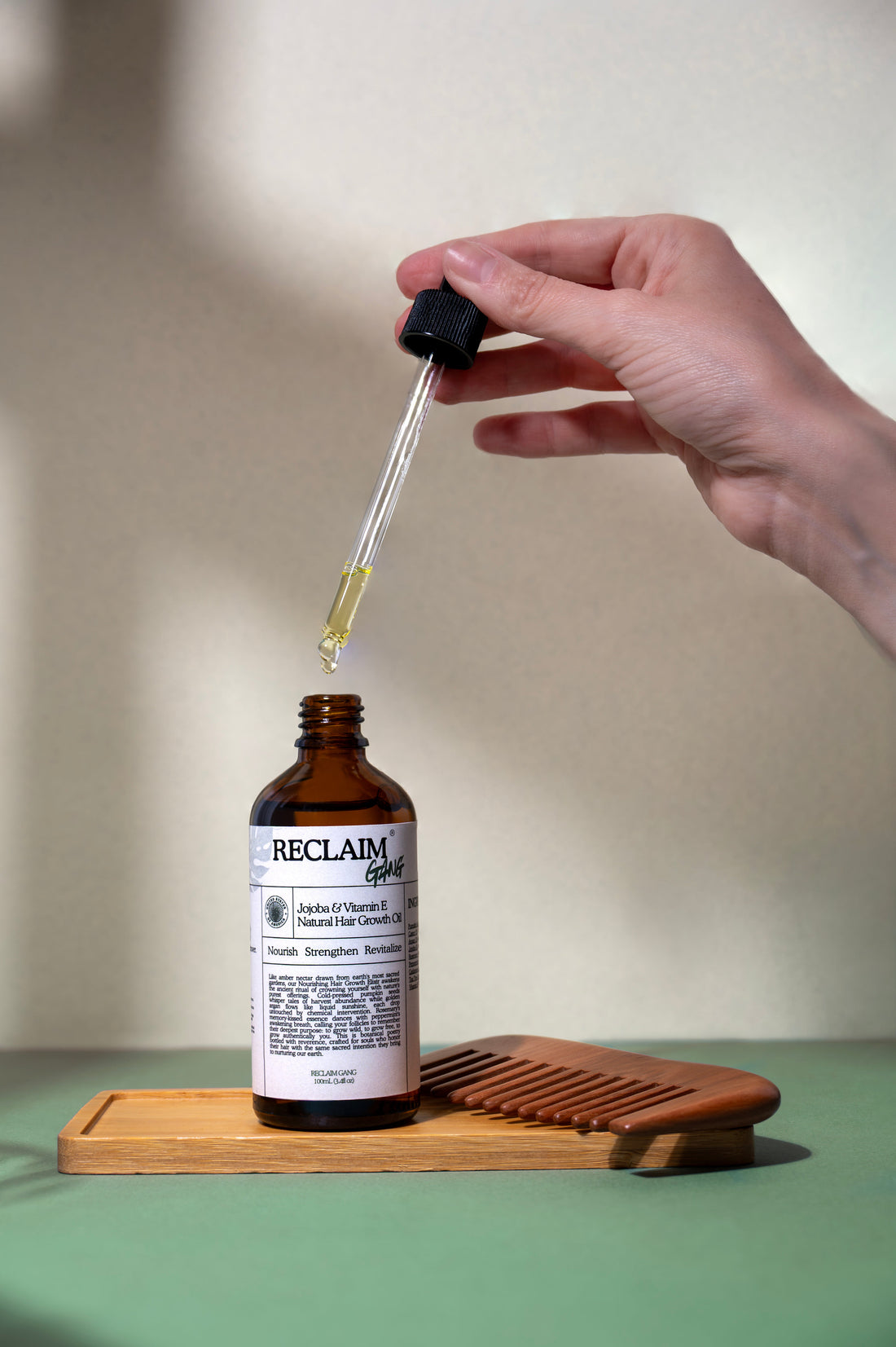 Reclaim Gang RU58841 serum held in hand
