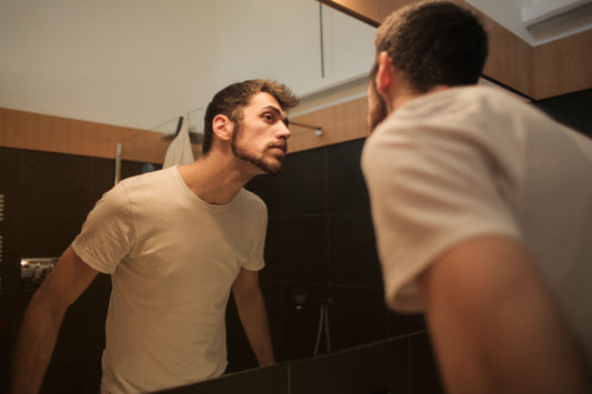 Man checking whether minoxidil is working